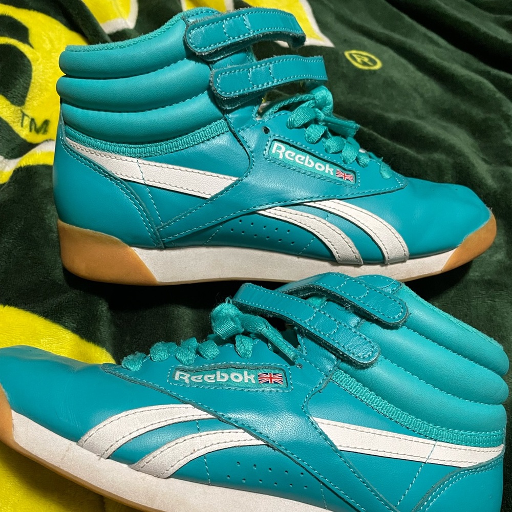 Teal retro style reeboks.